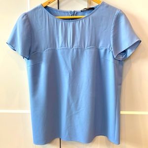 Hugo Boss light blue short sleeve top.